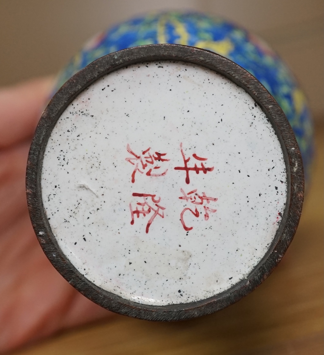 A pair of Chinese Guangzhou enamel vases, 19th century and an 18th century Guangzhou enamel dish, largest 26cm in diameter (3). Condition - fair